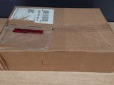 a cardboard box with a label on it on a table