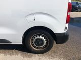 a white van that is parked in a parking lot