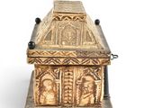 an image of a wooden box with carvings on it