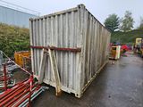 a large container sitting on the side of the road