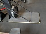 a machine that is sitting on the floor in a gym