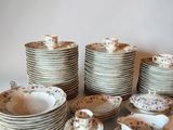 a lot of plates and cups on the table