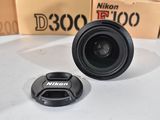 a camera lens sitting on top of a table next to a box of boxes