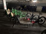 many bikes that are parked in a parking garage