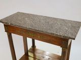 a small table with a marble top on a white background