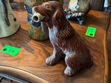 a dog figurine sitting on top of a wooden table