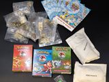 the contents of a pokemon trading card game are laid out on the table