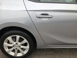 a silver car that is parked in a parking lot