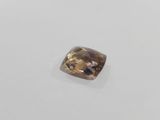 a brown diamond on a white surface