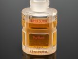 an image of a bottle of perfume sitting on a black surface