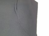 the back of a pair of grey pants with a white background