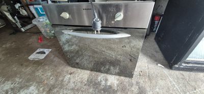 an image of a kitchen with a sink and a refrigerator