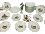 a lot of plates that are sitting on a table