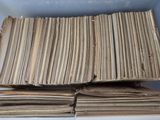 a lot of old papers stacked on top of each other