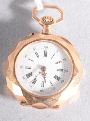 a gold pocket watch with roman numerals on it