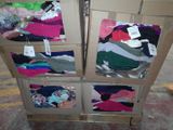 several boxes of clothing are stacked on top of each other