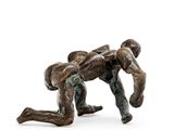 statue of a man wrestling with another man in a wrestling ring