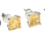 quatre paires de boucles d'oreilles en saphir bleu et jaune sur fond blanc
