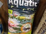 a bag of aquatite sitting on a shelf next to a bag of water