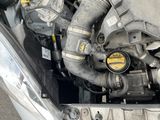 a picture of a car engine with its hood open