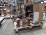 several pieces of wood are stacked on a pallet in a warehouse