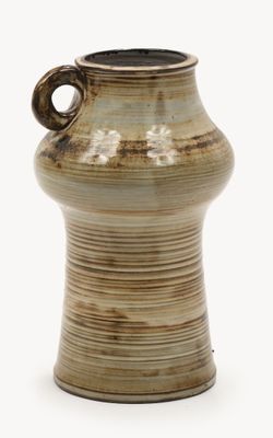 a brown vase with a handle on a white background