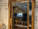 a mirror sitting on top of a wooden table