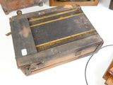 three old wooden boxes sitting on a white surface