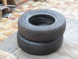 two tires stacked on top of each other on the ground