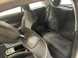 the interior of a car with black leather seats and black trims
