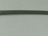 a small knife with a gold handle on a white surface