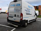 a white van that is parked in a parking lot