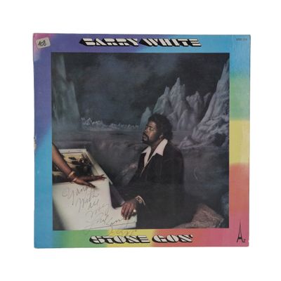 the album cover shows a man sitting at a table with an iceberg in the background