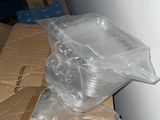 a box with a plastic bag on top of it next to a wall