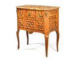a small wooden chest of drawers with a marble top