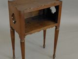 a small wooden table with a drawer on it
