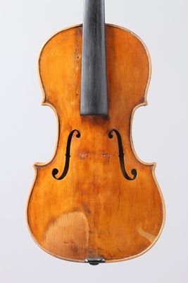 an old violin with a bow on a white background