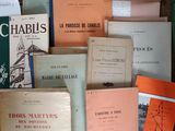 many books that are sitting on top of a table