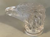 crystal figurine of an eagle head on a pedestal