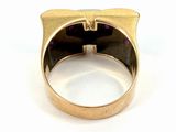 an image of a gold ring with a purple stone in the center