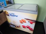 a small ice cream machine sitting in a kitchen