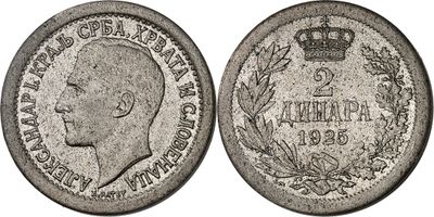 a silver coin with a crown on top of it