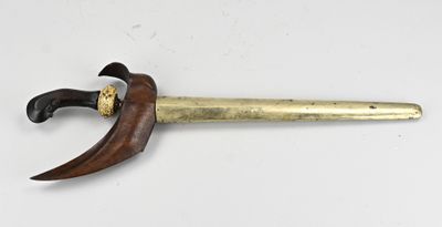 a close up of a knife with a wooden handle on a white surface