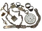 a lot of assorted items that include a watch, bracelets, keys, and other items