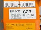 an image of a close up of an orange device with a tag on it
