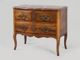an antique chest of drawers with marble top