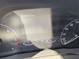 a close up of a car dashboard with a speedometer and gauges