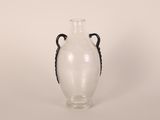 a glass vase with a black handle on a white background