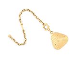 a close up of a gold necklace with a heart on it