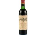 a bottle of wine sitting on top of a white surface